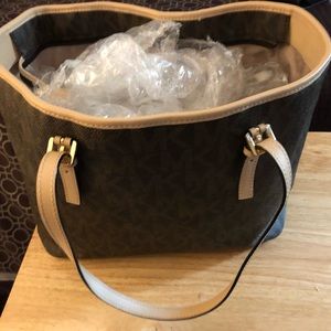 Michael Kors  tote bag .  This item is re-poshed. Never used it much .